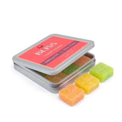 Bliss Edibles Sweet Escape THC Gummies 1080mg in open tin showing pieces